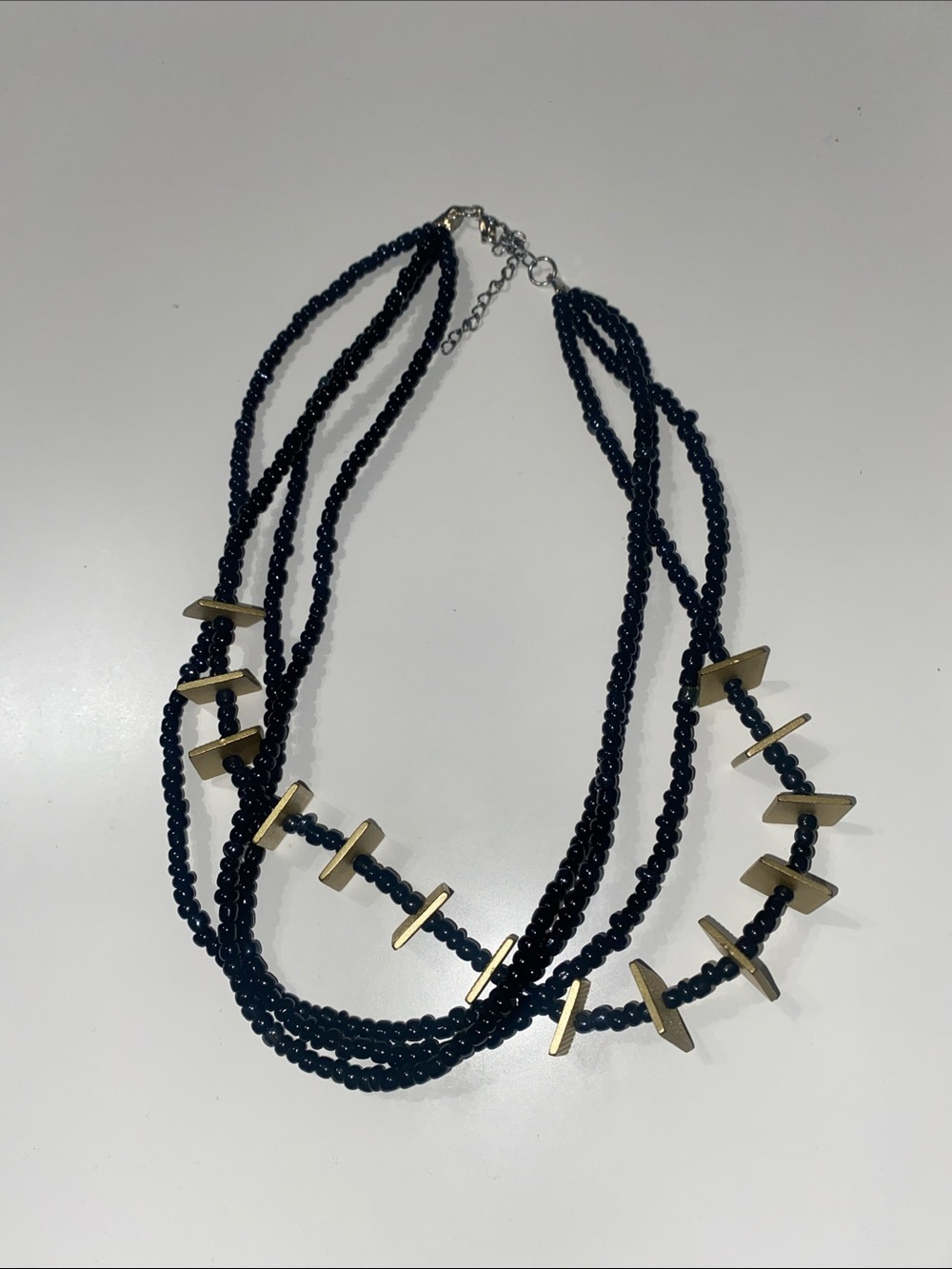 Multi-Strand Black Beaded Necklace with Gold Accents
